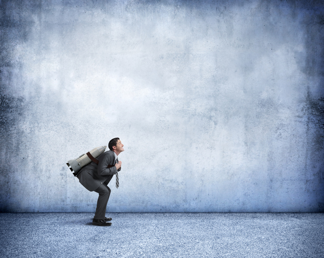 Businessman With Rocket Strapped To His Back