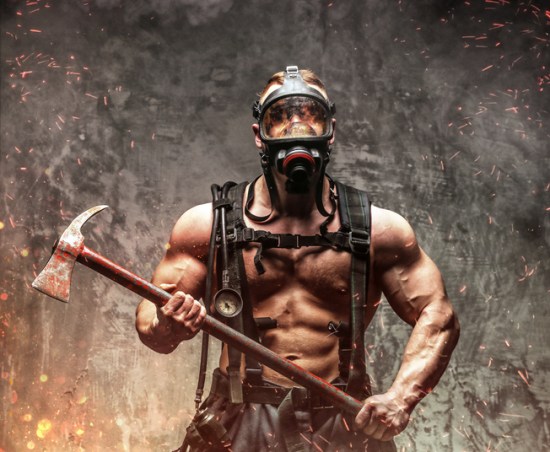 Fireman in fire sparks and smoke.