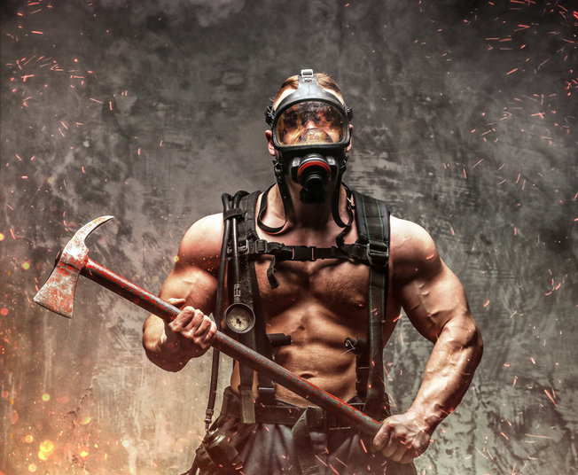 Fireman in fire sparks and smoke.