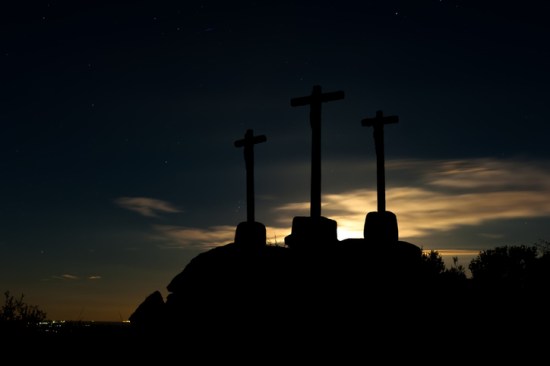 old crosses of stone to the backlight